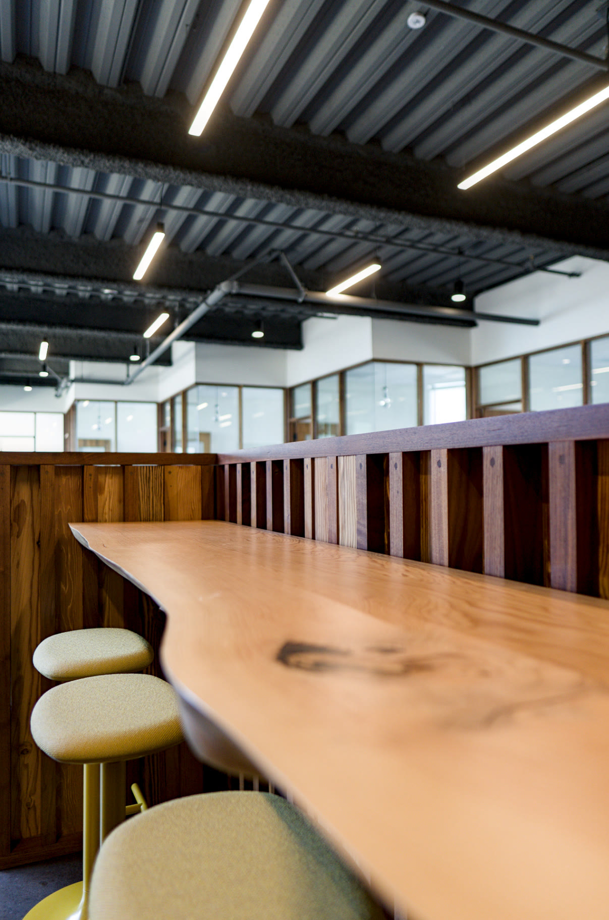 Coffee lounge with live-edge bar and pendant lighting